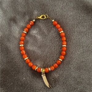 Vibrant Orange Beaded Bracelet with Gold Accents